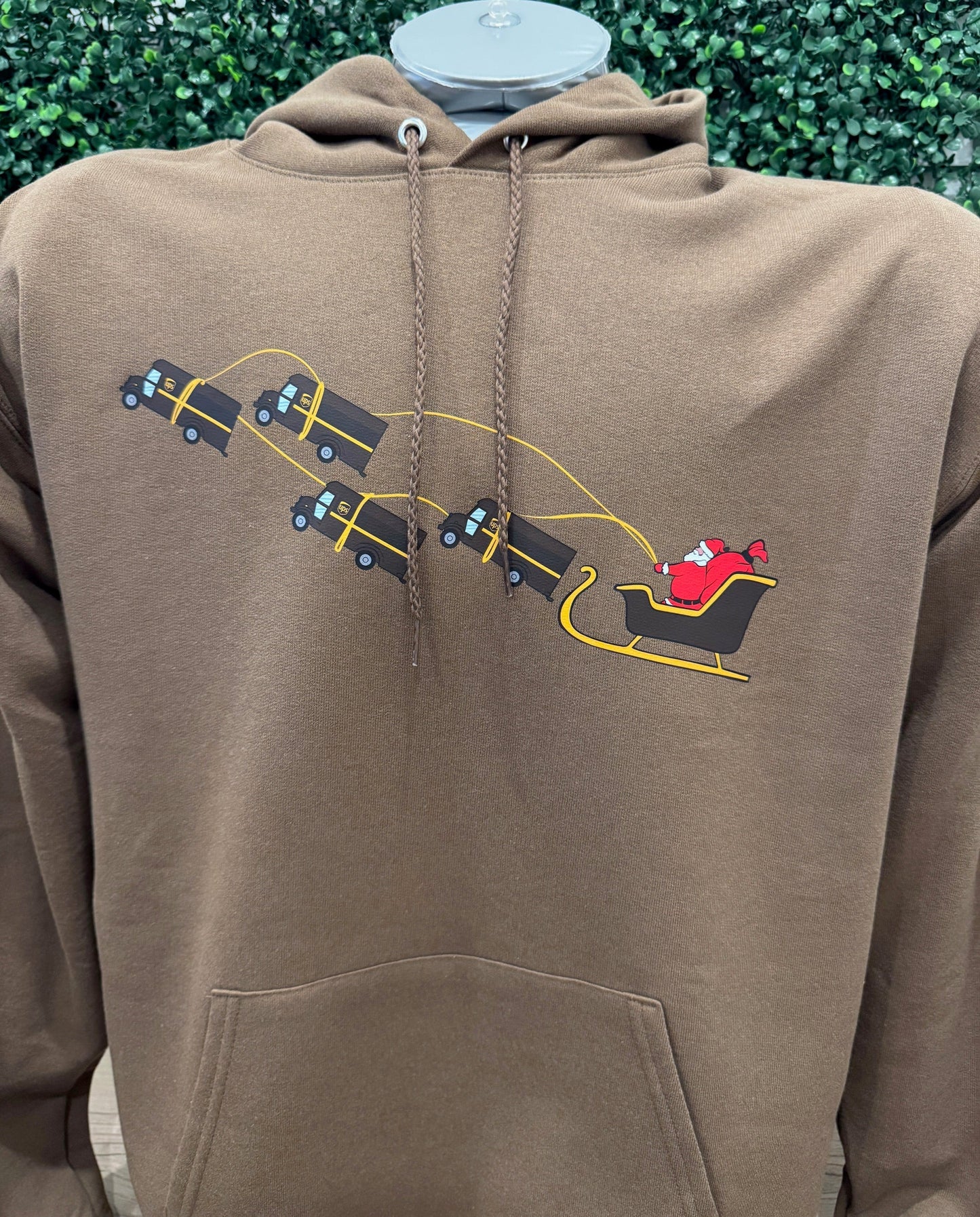 UPS Santa Peak Season Christmas Hoodie with Santa and UPS trucks design.