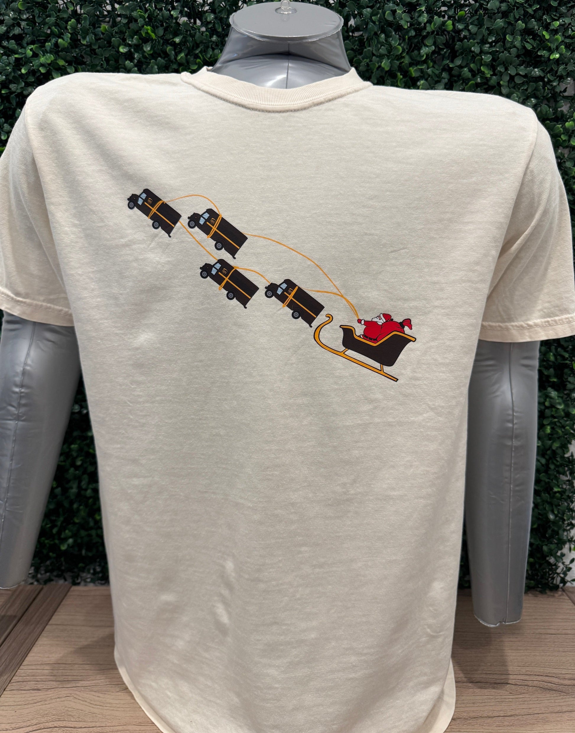UPS Santa Peak Season Christmas Tee with Santa and UPS trucks design, holiday-themed screen-printed t-shirt.