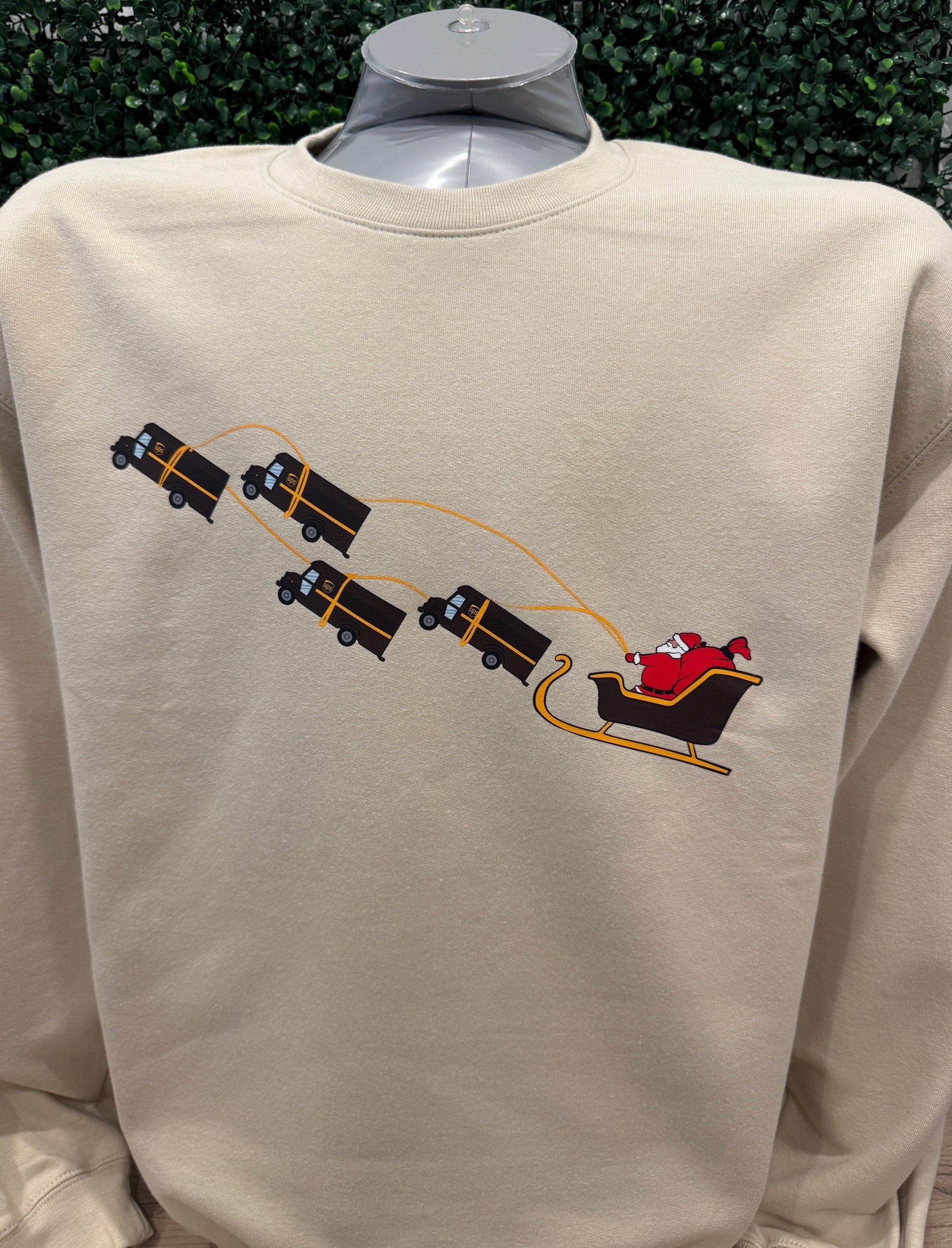 UPS Santa Peak Season Christmas crewneck sweater with unique Santa and UPS trucks design.