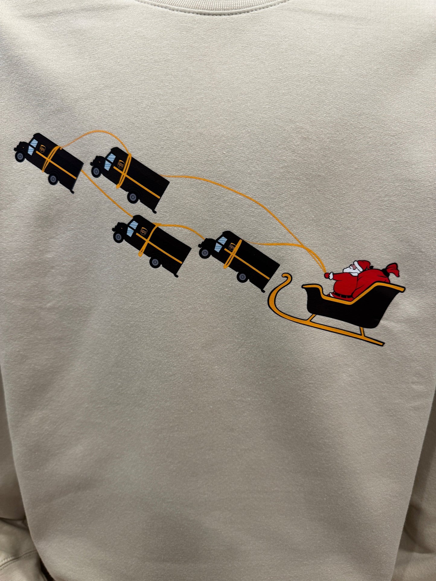 UPS Santa Peak Season Christmas Crewneck Sweater with Santa in sleigh pulled by UPS trucks design.